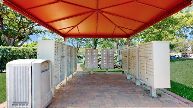 a view of swimming pool with outdoor seating and plants