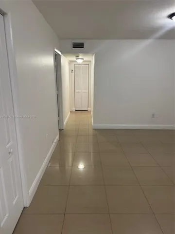 a view of hallway with an empty space