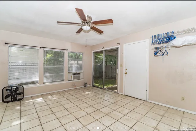 a view of an empty room and window