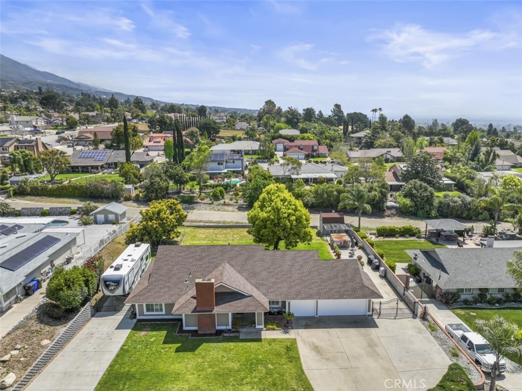 5345 Jasper Street Rancho Cucamonga, CA 91701 - Photo 1 of 1 an aerial view of residential houses with outdoor space and trees