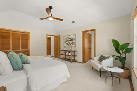 a bedroom with a bed and a couch