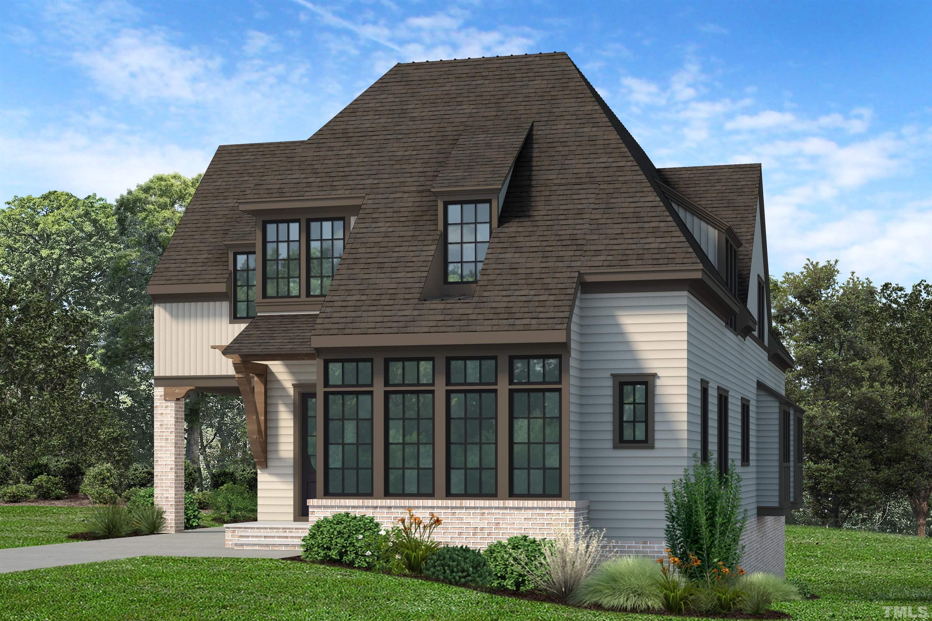 a front view of a house with a garden