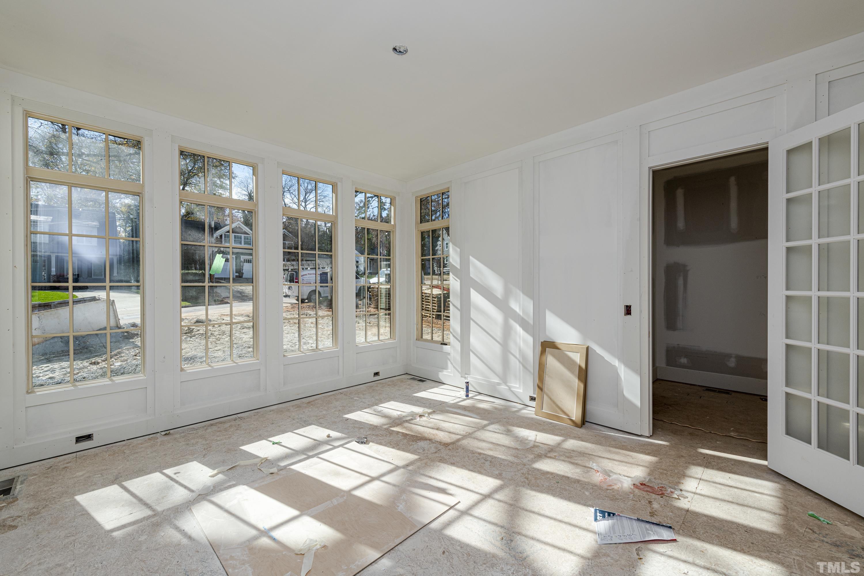 3020 Farrior Road Raleigh, NC 27607 - Photo 4 of 17 a view of an entryway with wooden floor and windows
