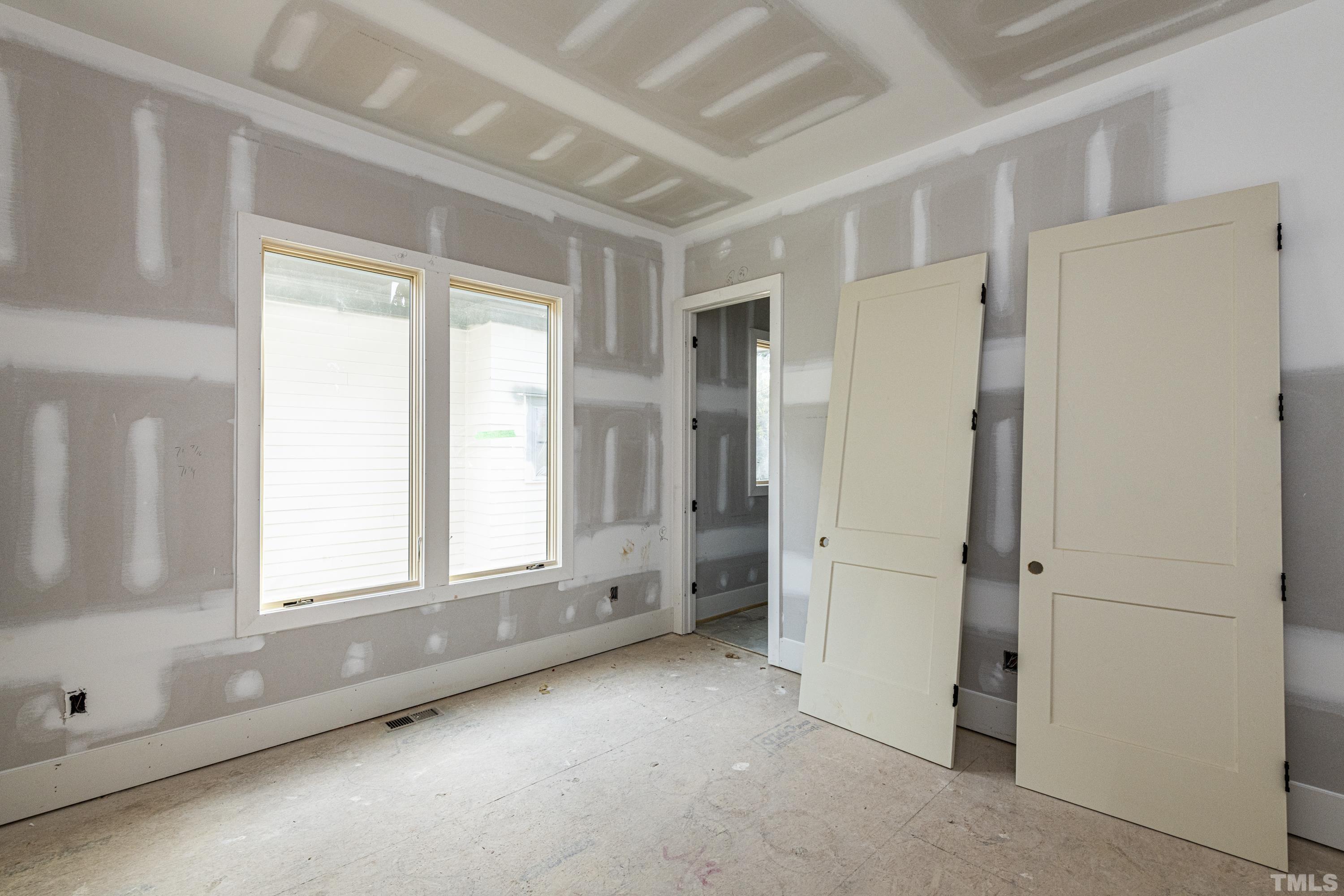 3020 Farrior Road Raleigh, NC 27607 - Photo 5 of 17 an empty room with windows and closet