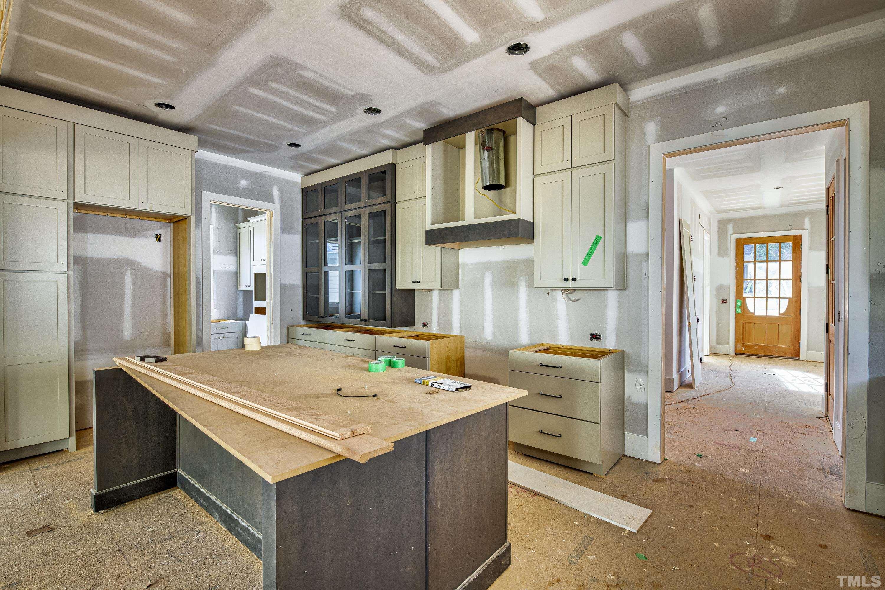 3020 Farrior Road Raleigh, NC 27607 - Photo 8 of 17 a open kitchen with stainless steel appliances kitchen island granite countertop a sink and cabinets