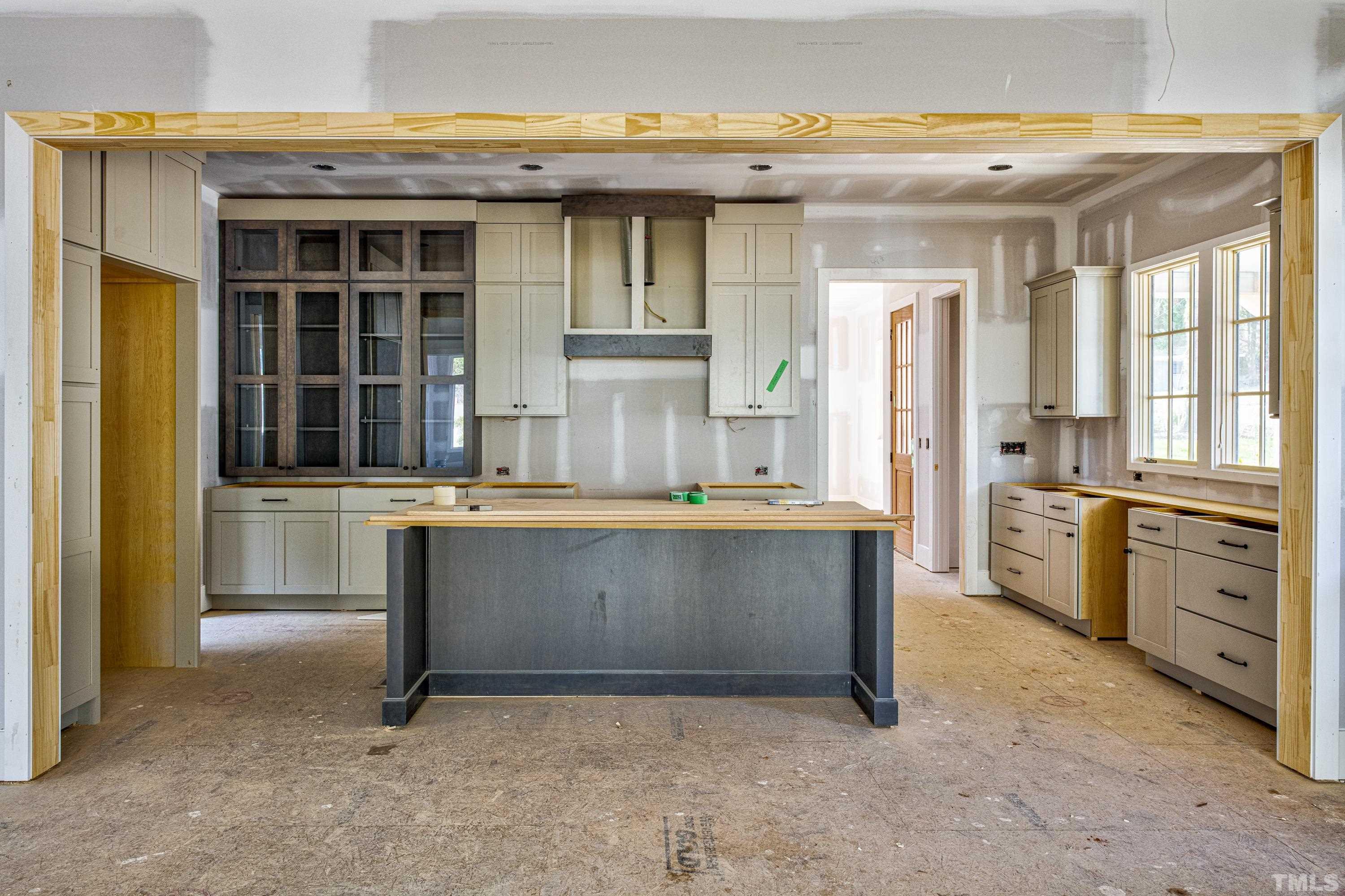 3020 Farrior Road Raleigh, NC 27607 - Photo 9 of 17 a living room with granite countertop furniture and a sink