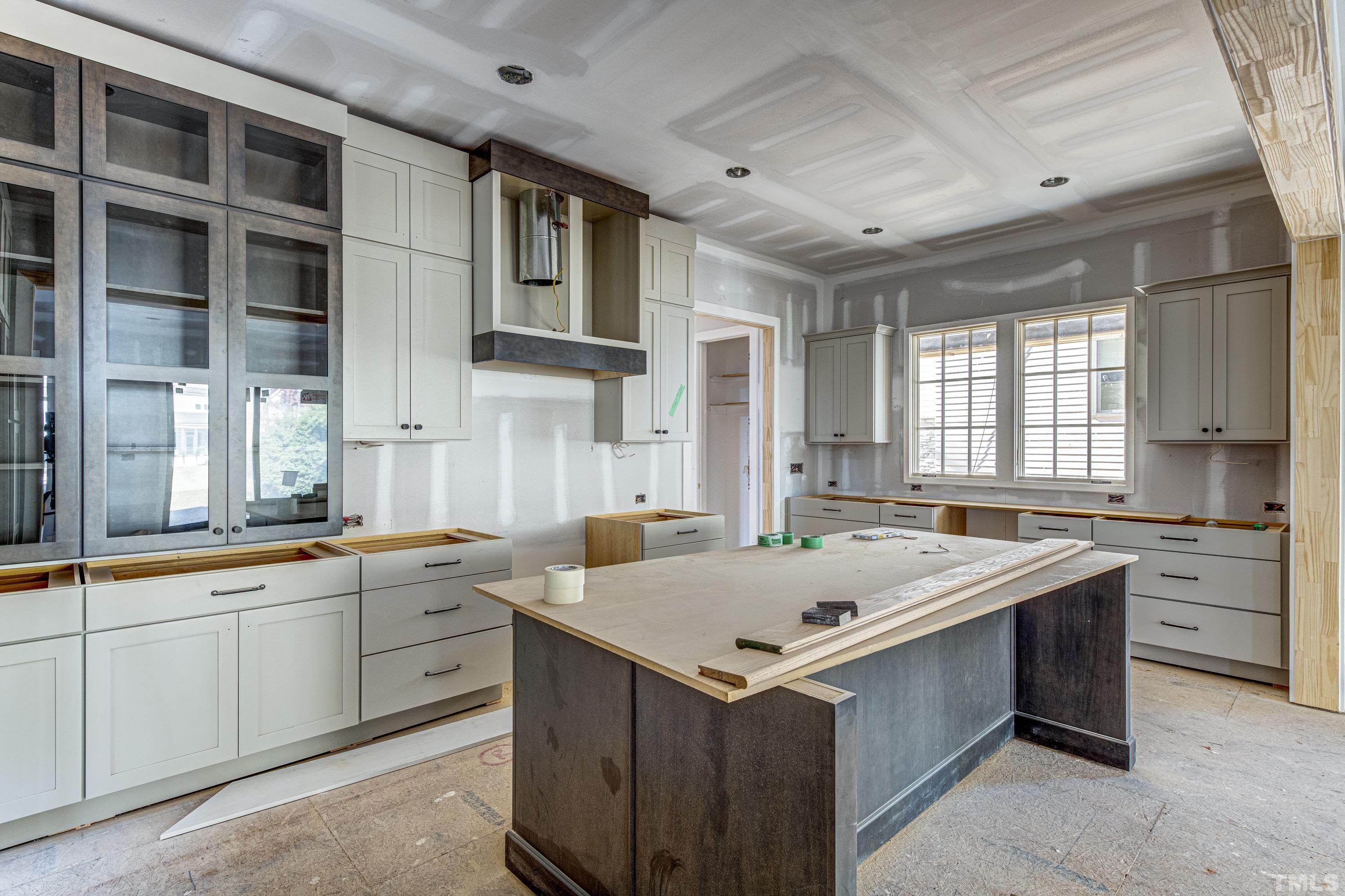 3020 Farrior Road Raleigh, NC 27607 - Photo 10 of 17 a kitchen that has a sink and a stove in it