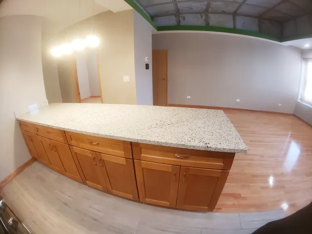 a room with granite countertop sink