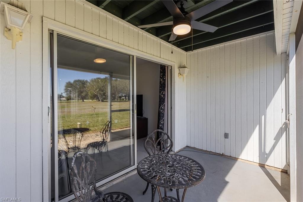 452 Bristle Cone Lane, Unit 27 Naples, FL 34113 - Photo 14 of 16 Sunroom / solarium featuring a ceiling fan