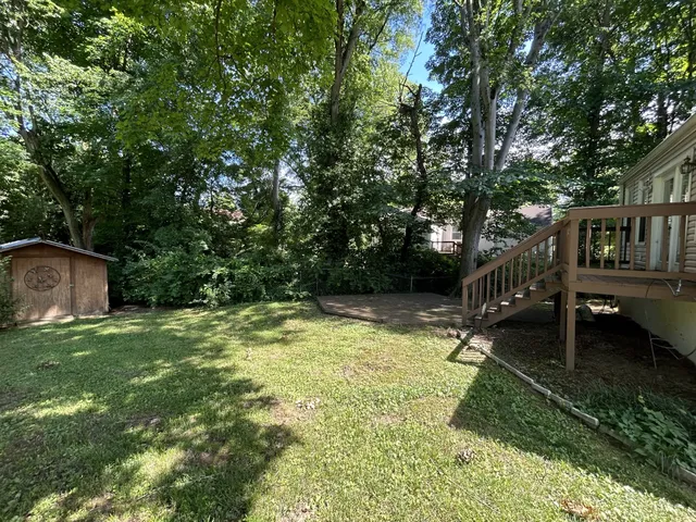 a backyard of a house with lots of green space