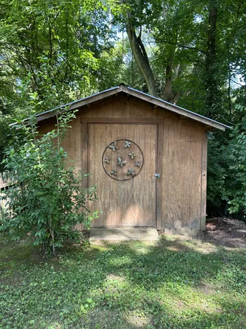 a wooden door in front of a house