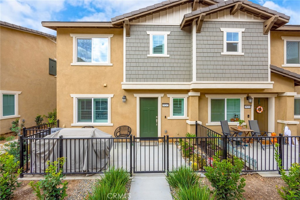 19245 Sequoia Grv Street Riverside, CA 92507 - Photo 1 of 25 a front view of a house with a garden