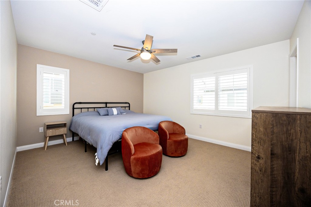 19245 Sequoia Grv Street Riverside, CA 92507 - Photo 12 of 25 a bedroom with a bed and window