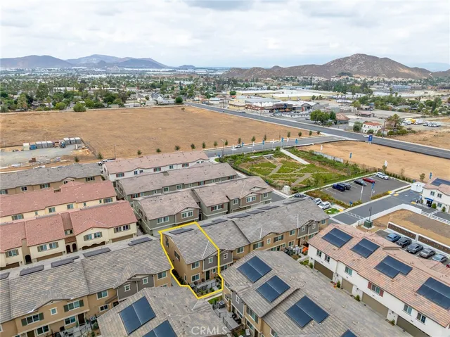 an aerial view of residential houses and outdoor space