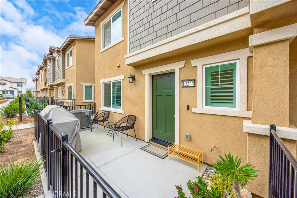 19245 Sequoia Grv Street Riverside, CA 92507 - Photo 2 of 25 a balcony view with couple of chairs and potted plant