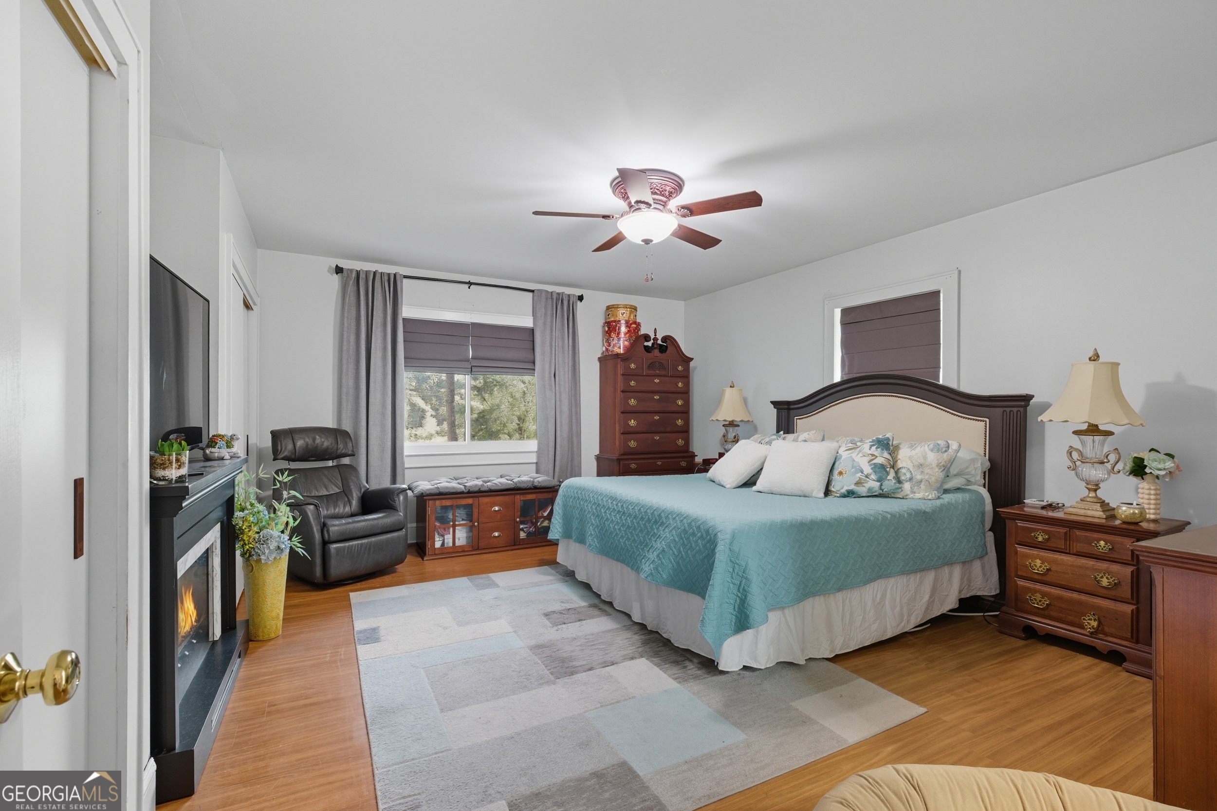 27 Rock Quarry Road Toccoa, GA 30577 - Photo 14 of 61 a bedroom with a large bed and a chandelier