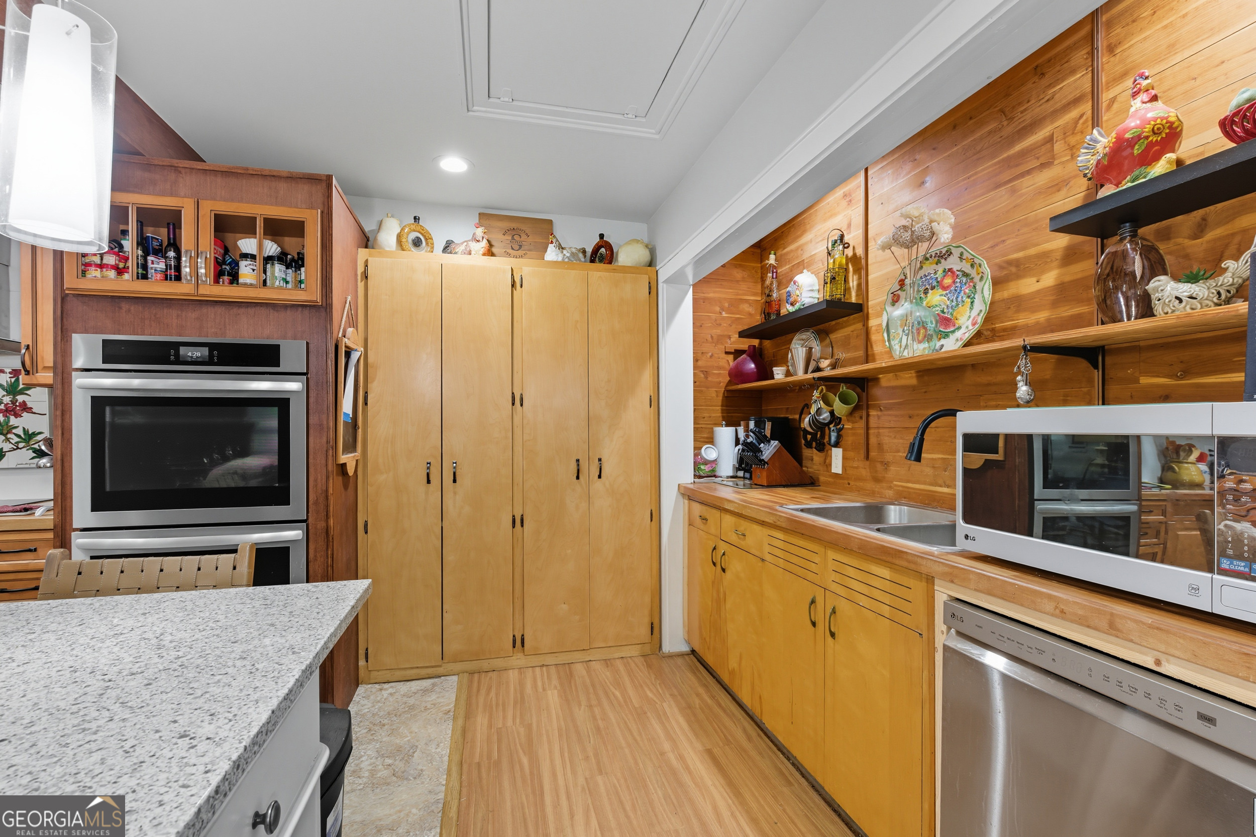 27 Rock Quarry Road Toccoa, GA 30577 - Photo 19 of 61 a kitchen with stainless steel appliances granite countertop a stove and a refrigerator