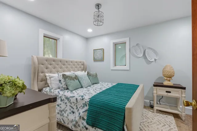 a living room with furniture and a floor to ceiling window