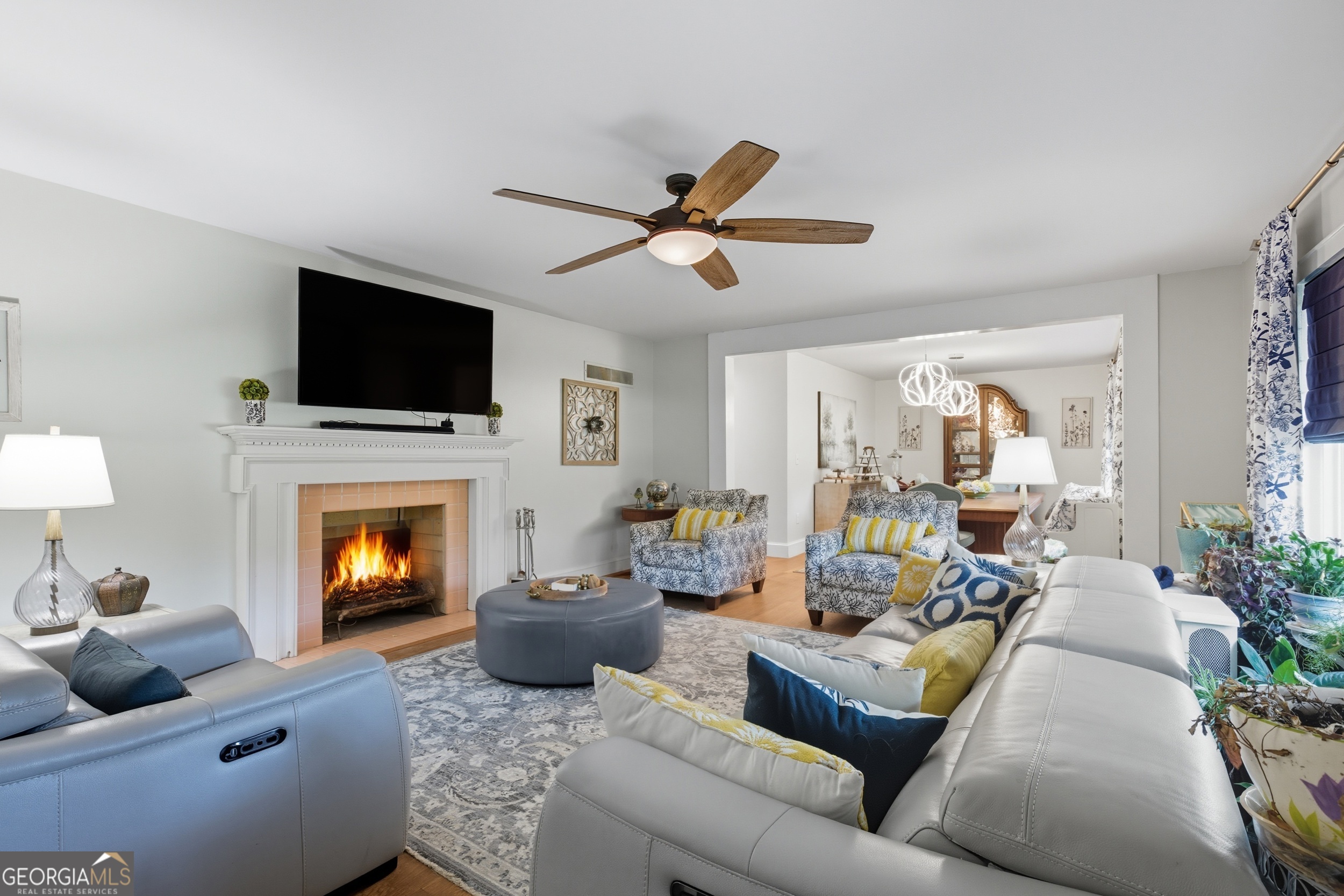 27 Rock Quarry Road Toccoa, GA 30577 - Photo 3 of 61 a living room with furniture a fireplace and a flat screen tv