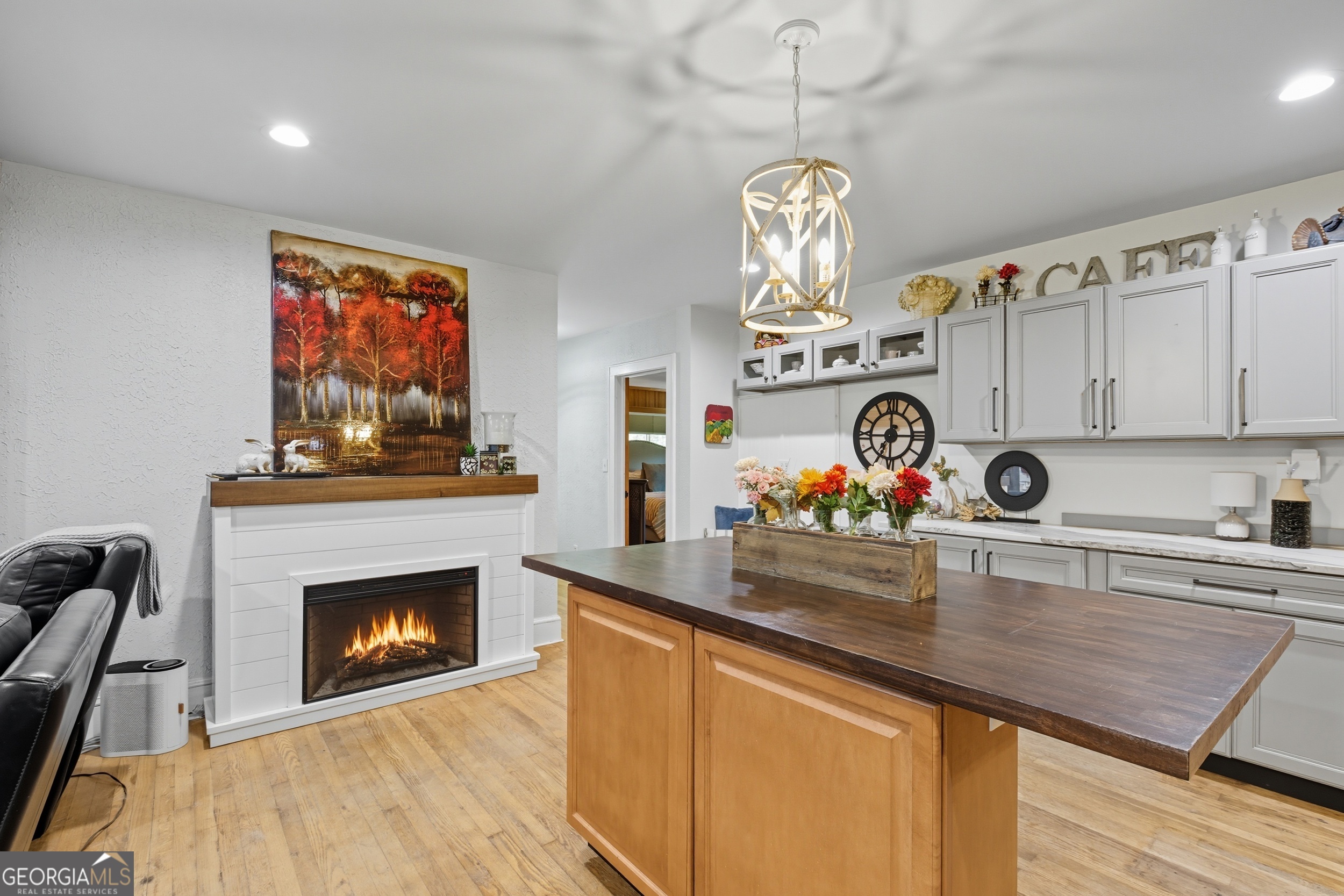 27 Rock Quarry Road Toccoa, GA 30577 - Photo 35 of 61 a view of a kitchen with a stove wooden floor and a chandelier