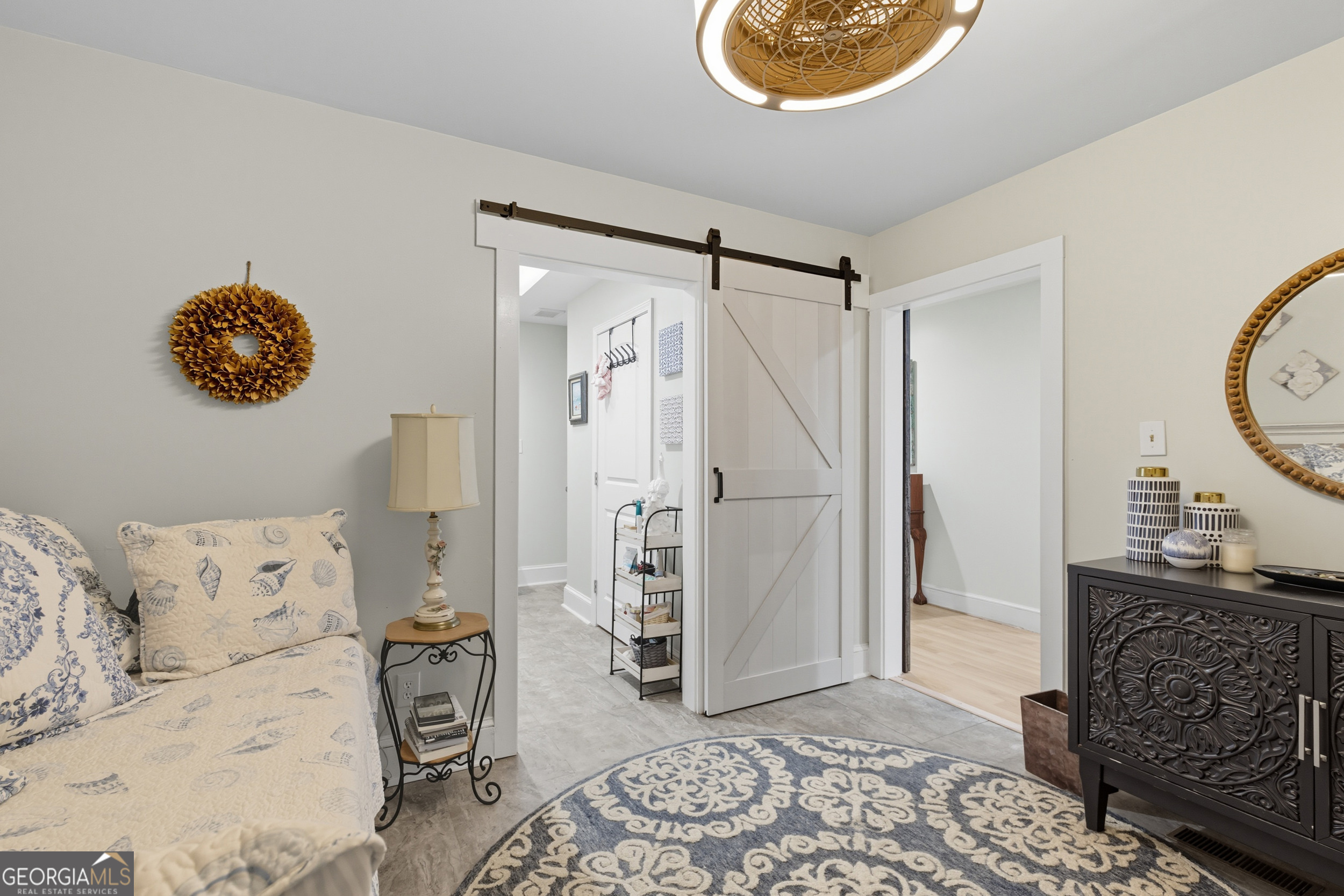 27 Rock Quarry Road Toccoa, GA 30577 - Photo 40 of 61 a bedroom with a bed and a chandelier