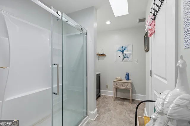 a view of a livingroom with a chandelier fan and closet
