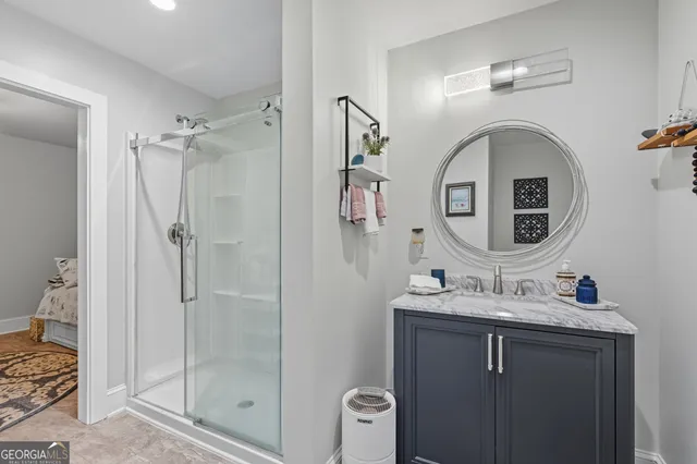 a view of a chair and tables in the back yard of the house