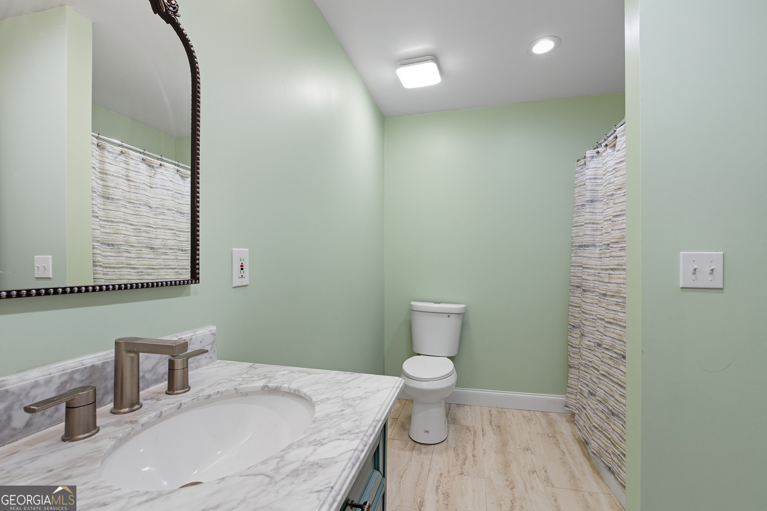 27 Rock Quarry Road Toccoa, GA 30577 - Photo 47 of 61 a bathroom with a sink and a mirror