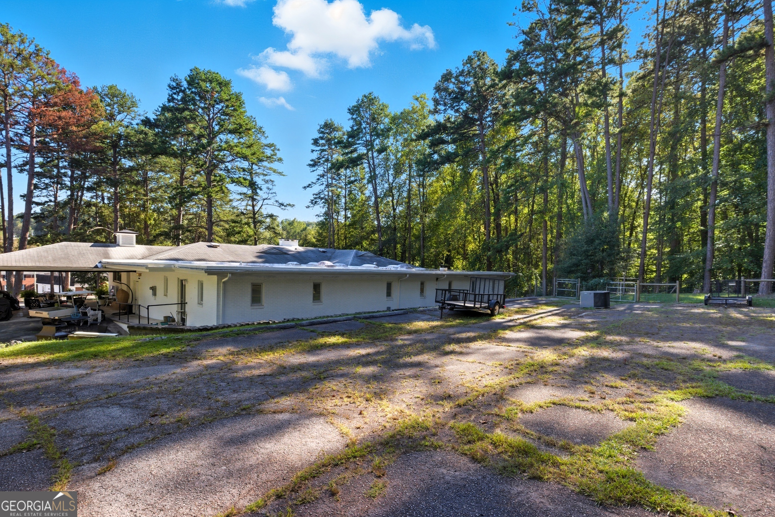 27 Rock Quarry Road Toccoa, GA 30577 - Photo 52 of 61 a backyard of a house with barbeque oven table and chairs