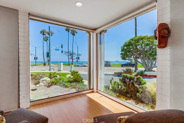 a living room with furniture and a kitchen view