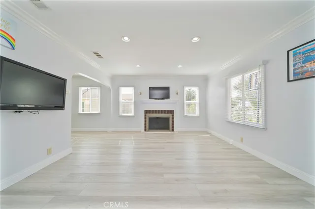 a view of a livingroom with an empty space and a window