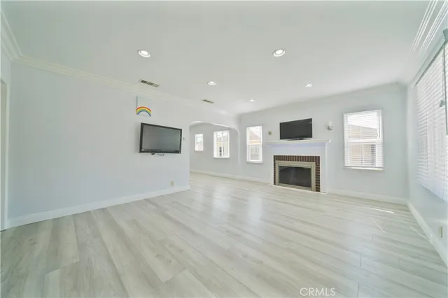 a view of a livingroom with an empty space and a fireplace