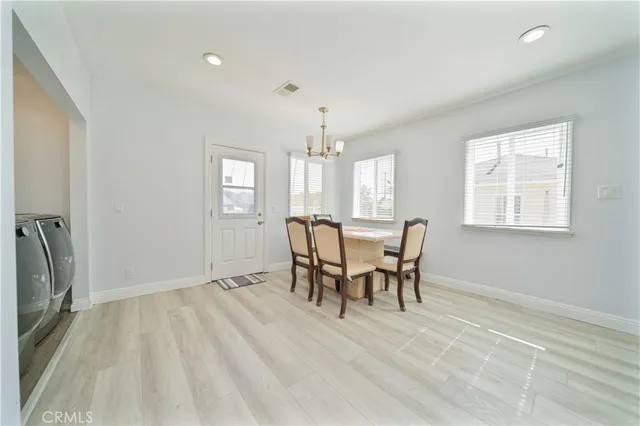 a view of a dining room with furniture and window