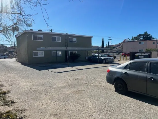a front view of a house with parking space