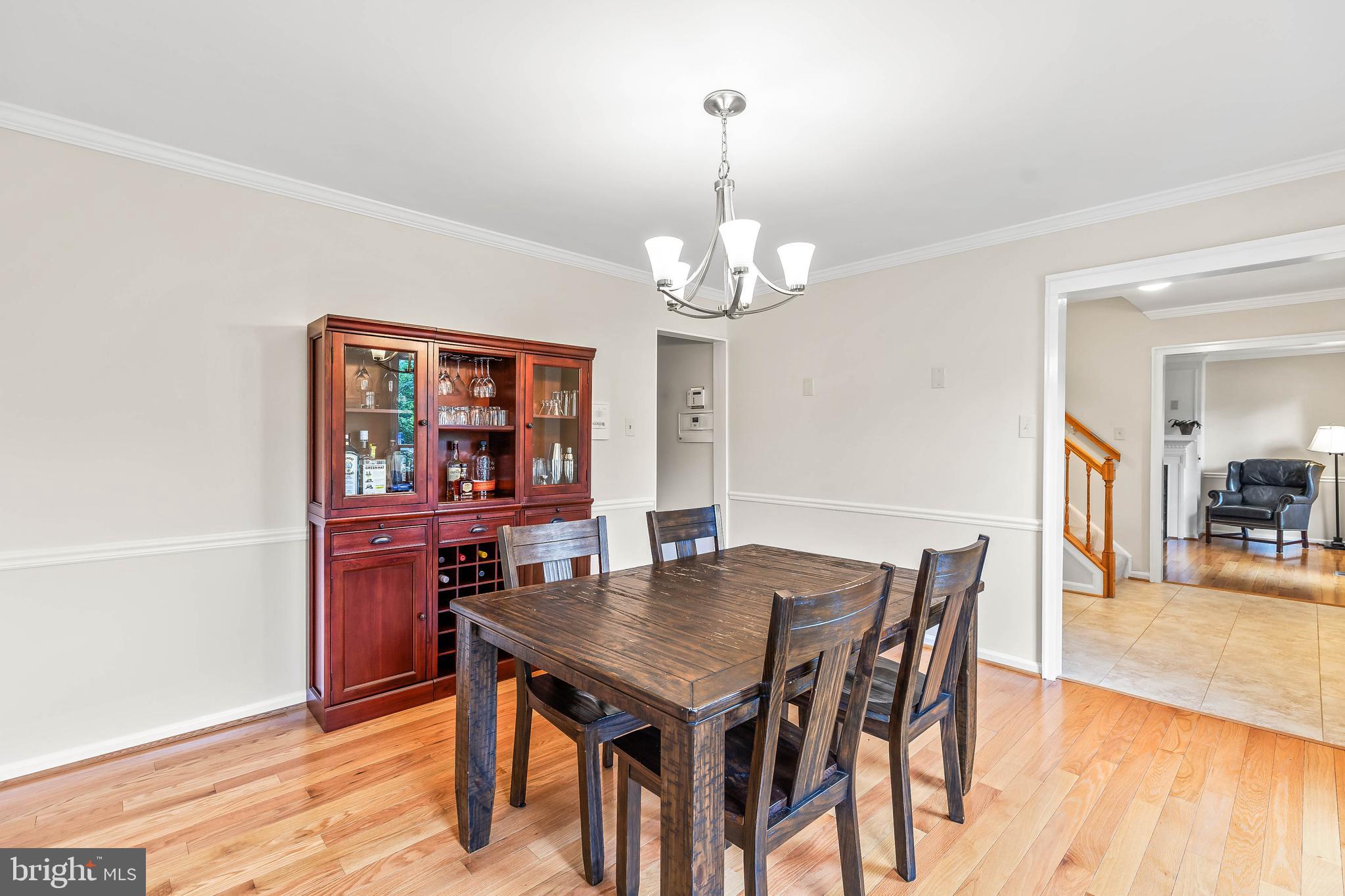 1868 Middlebridge Drive Silver Spring, MD 20906 - Photo 16 of 50 a view of a dining room with furniture and wooden floor