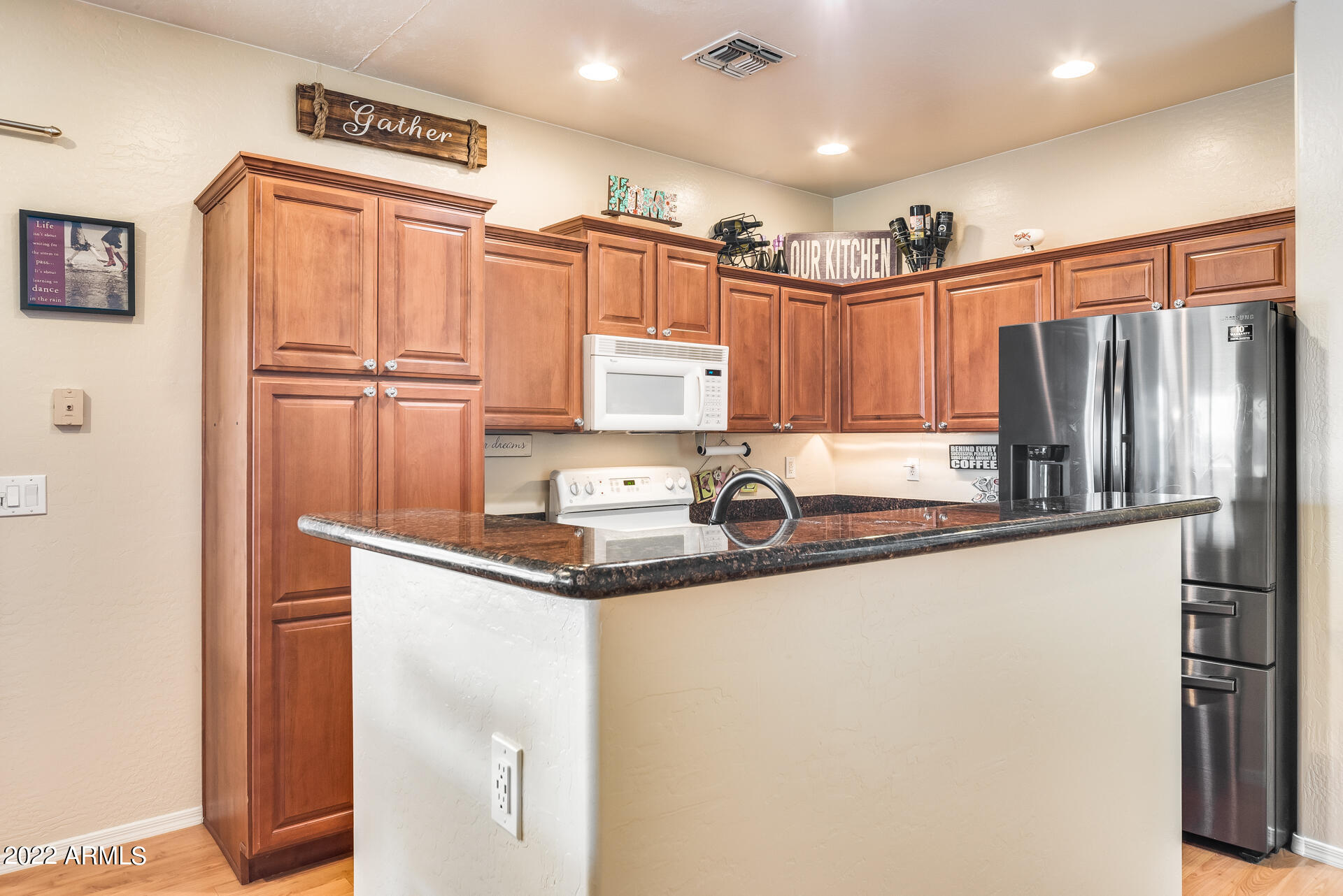 1868 South Rome Street Gilbert, AZ 85295 - Photo 9 of 34 a kitchen with stainless steel appliances granite countertop a refrigerator a sink and a stove