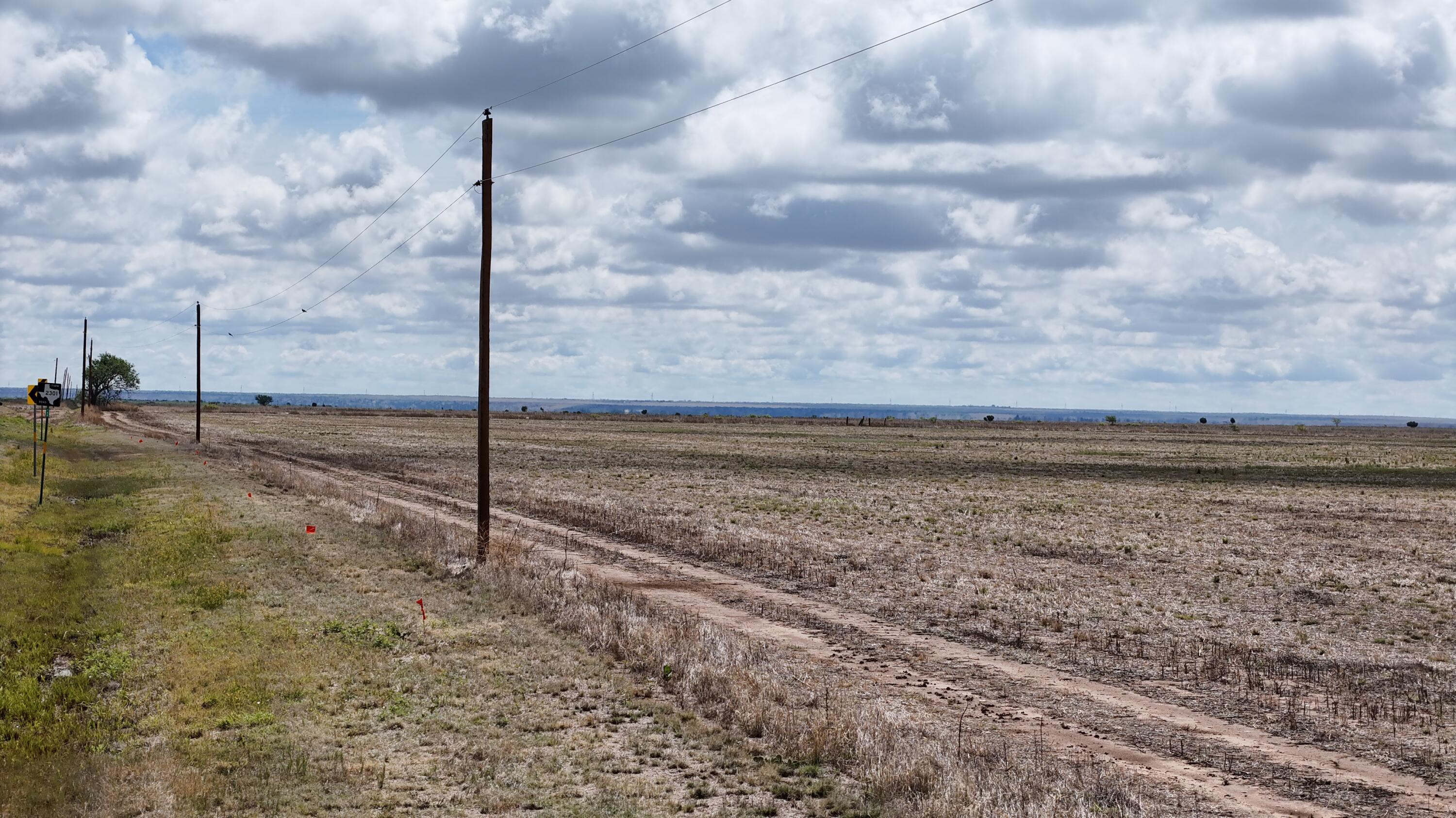 2301 Farm To Market Road Tulia, TX 79088 - Photo 8 of 11 a view of a dry yard with wooden fence