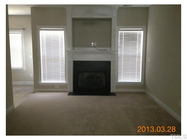 4809 Landover Pine Place Raleigh, NC 27616 - Photo 3 of 11 a view of empty room with a fireplace