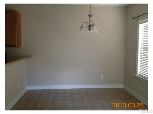 4809 Landover Pine Place Raleigh, NC 27616 - Photo 4 of 11 a view of a room with a window