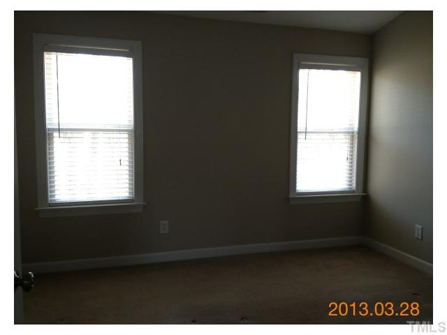 4809 Landover Pine Place Raleigh, NC 27616 - Photo 6 of 11 a view of an empty room and a window