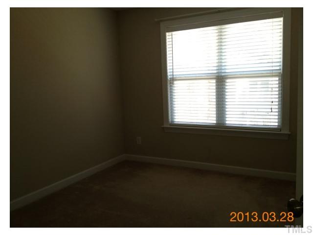 4809 Landover Pine Place Raleigh, NC 27616 - Photo 7 of 11 a view of an empty room and window