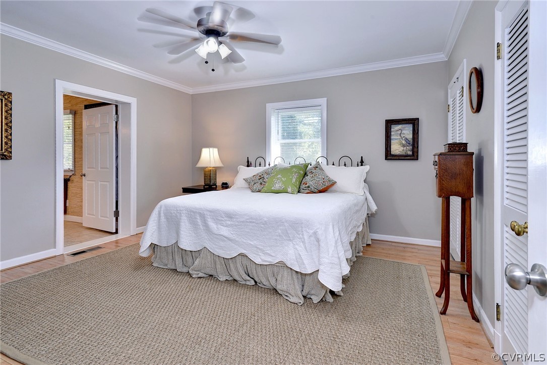 1020 Pine Hall Road Mathews, VA 23109 - Photo 14 of 49 a bed room with a bed and a chandelier