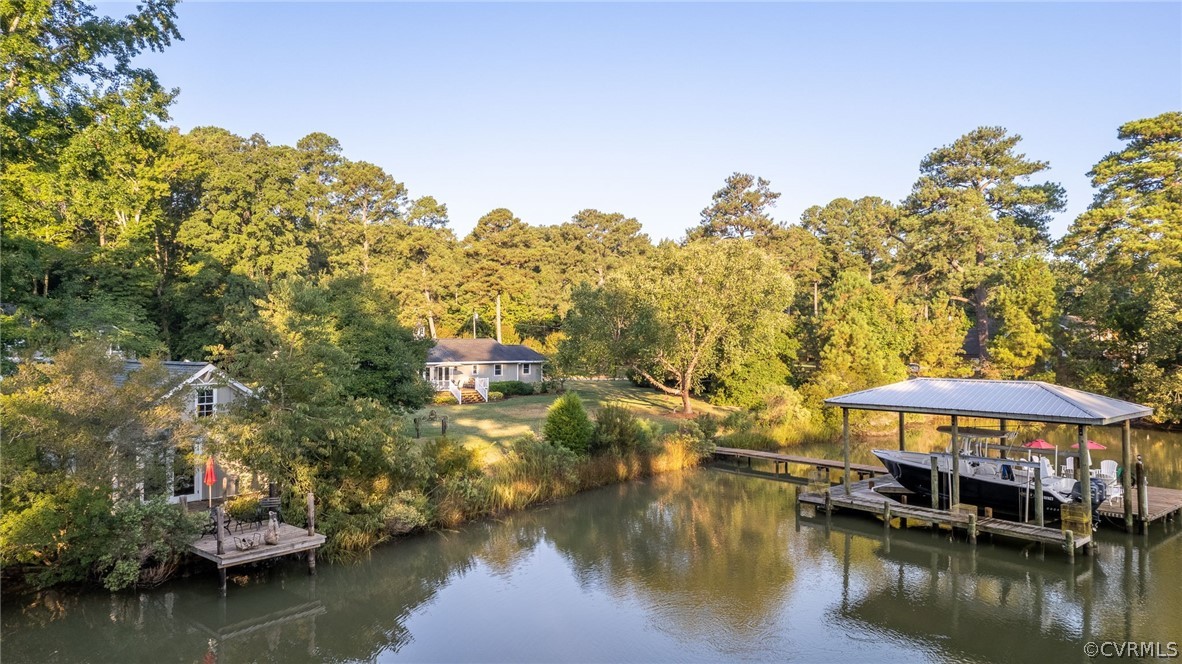 1020 Pine Hall Road Mathews, VA 23109 - Photo 2 of 49 a view of a lake with a house
