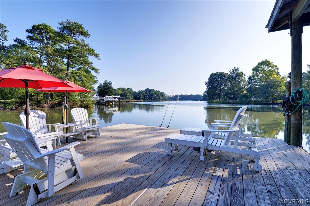 1020 Pine Hall Road Mathews, VA 23109 - Photo 27 of 49 a view of a chairs and table on the wooden deck