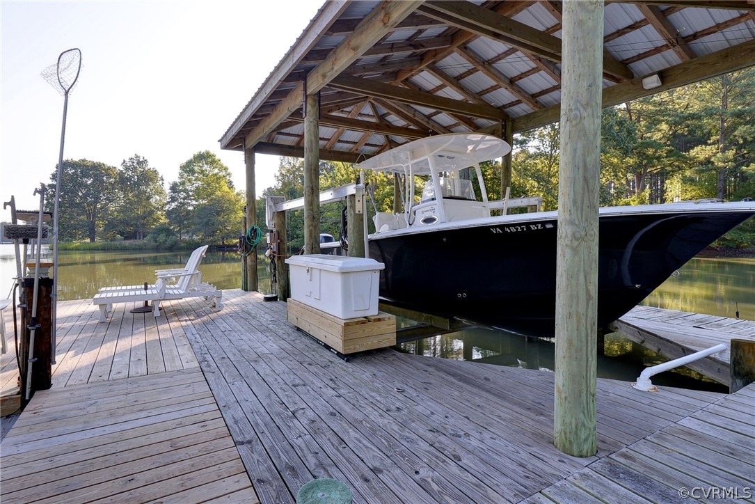 1020 Pine Hall Road Mathews, VA 23109 - Photo 28 of 49 a view of house with wooden floor and outdoor seating