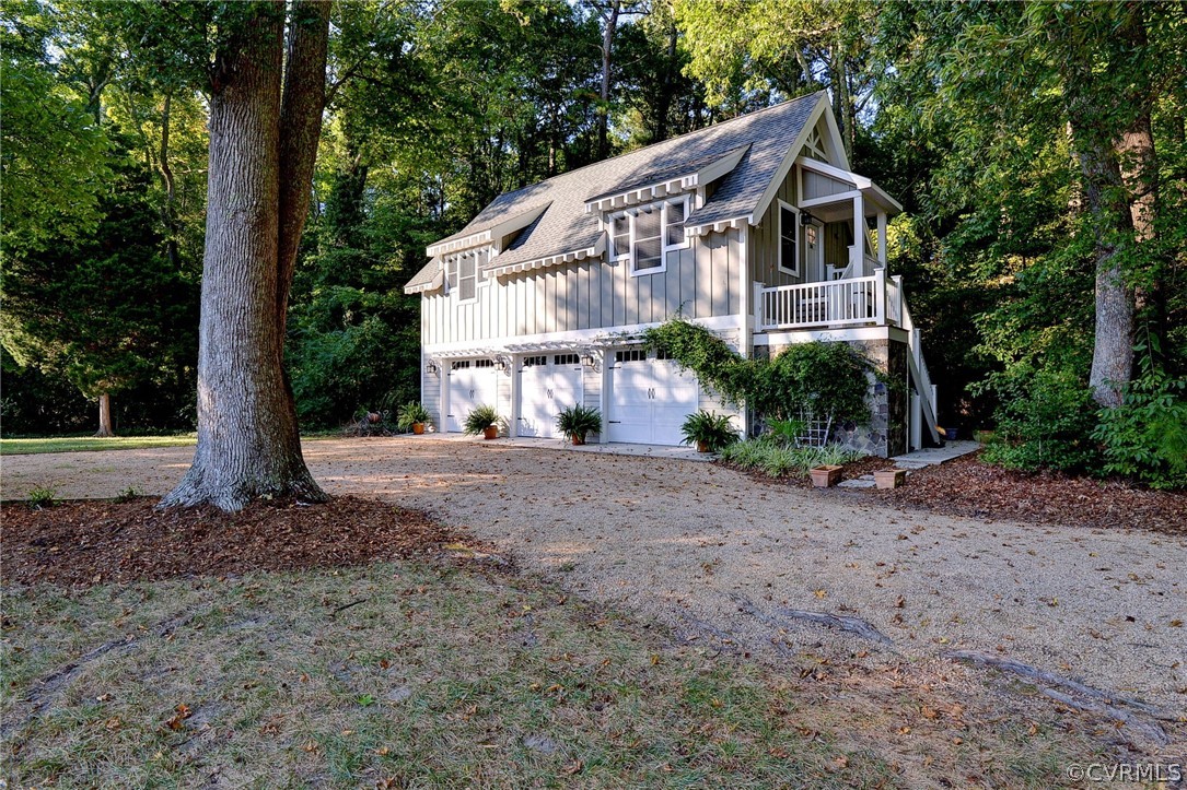 1020 Pine Hall Road Mathews, VA 23109 - Photo 29 of 49 a front view of a house with a yard and trees