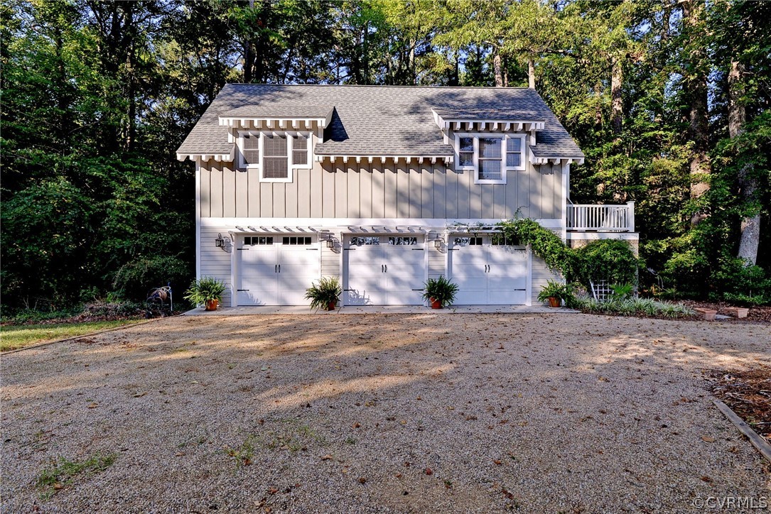 1020 Pine Hall Road Mathews, VA 23109 - Photo 30 of 49 a front view of a house with a yard and garage