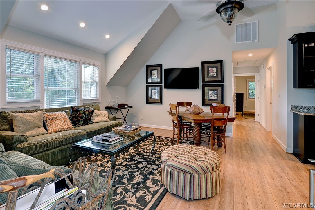 1020 Pine Hall Road Mathews, VA 23109 - Photo 31 of 49 a living room with furniture a flat screen tv and a large window