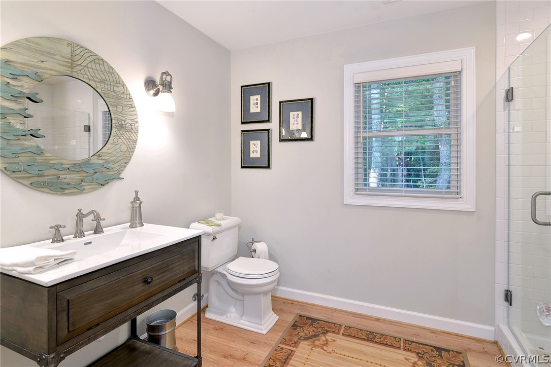 1020 Pine Hall Road Mathews, VA 23109 - Photo 35 of 49 a bathroom with a toilet sink and mirror