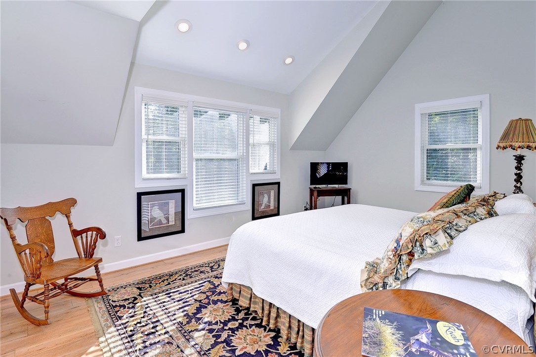 1020 Pine Hall Road Mathews, VA 23109 - Photo 37 of 49 a bedroom with a bed and wooden floor